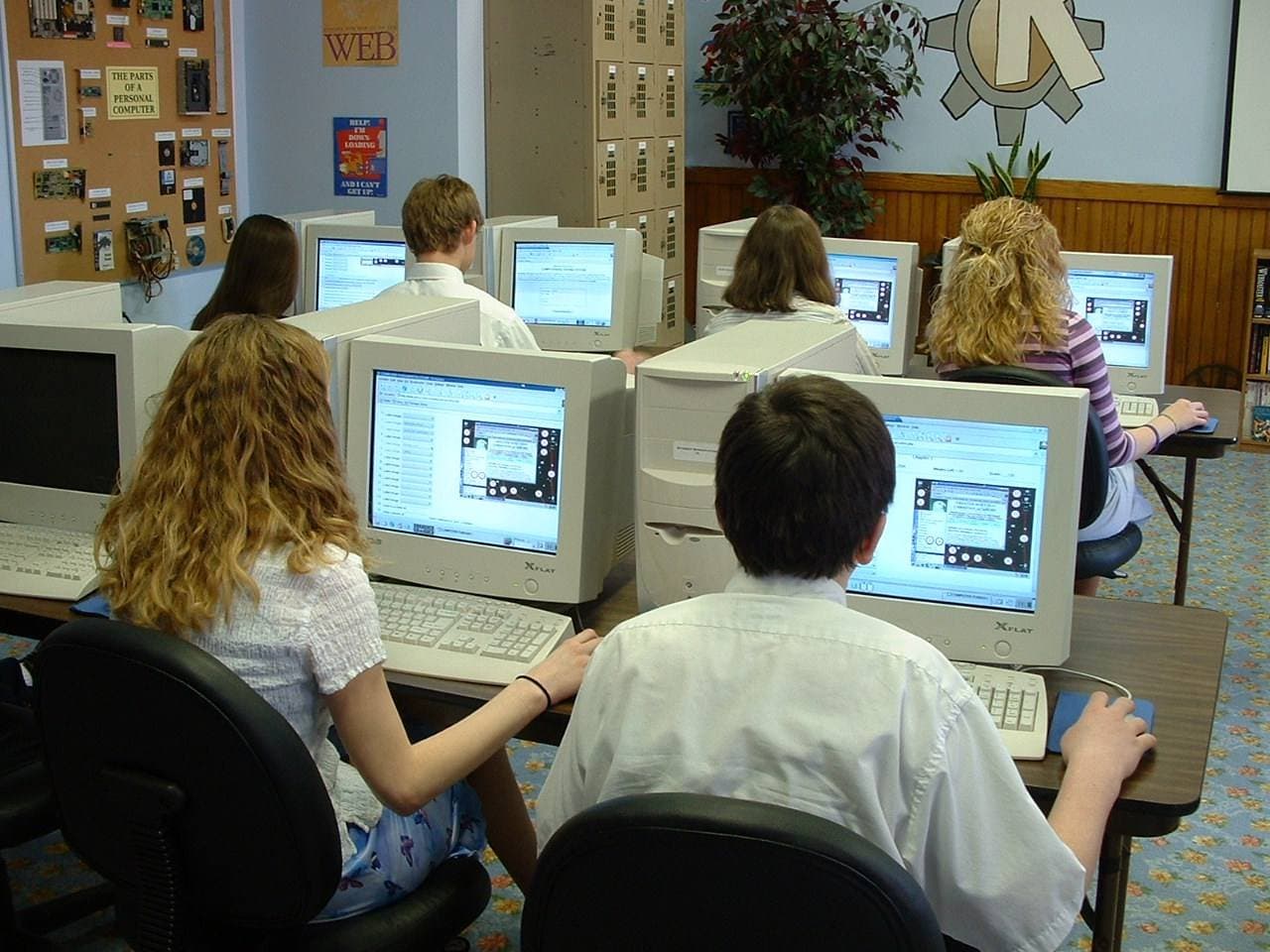 Students taking an exam on computers in a classroom