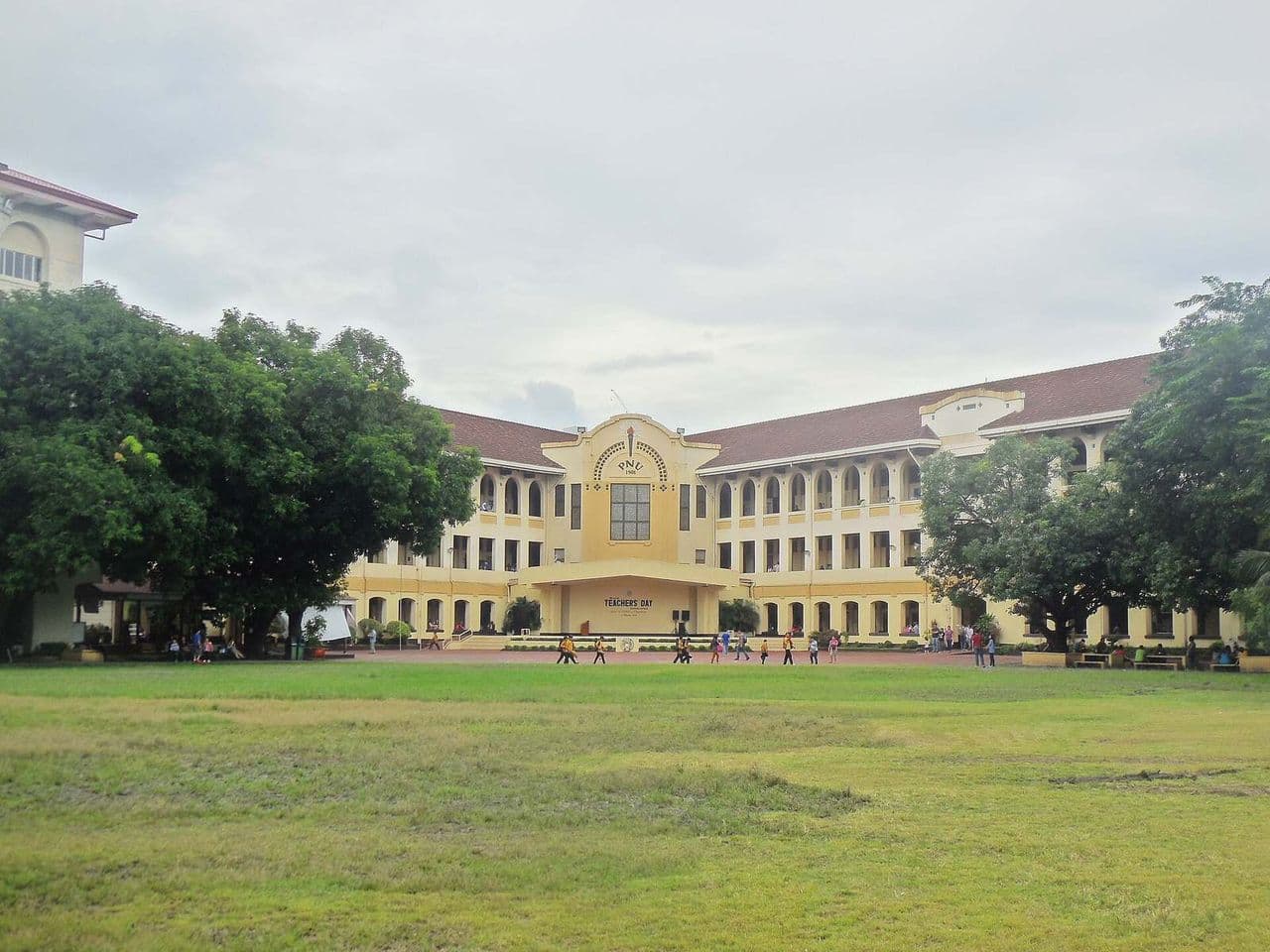 Students walking past the main building of the Philippine Normal University, a state university in Manila