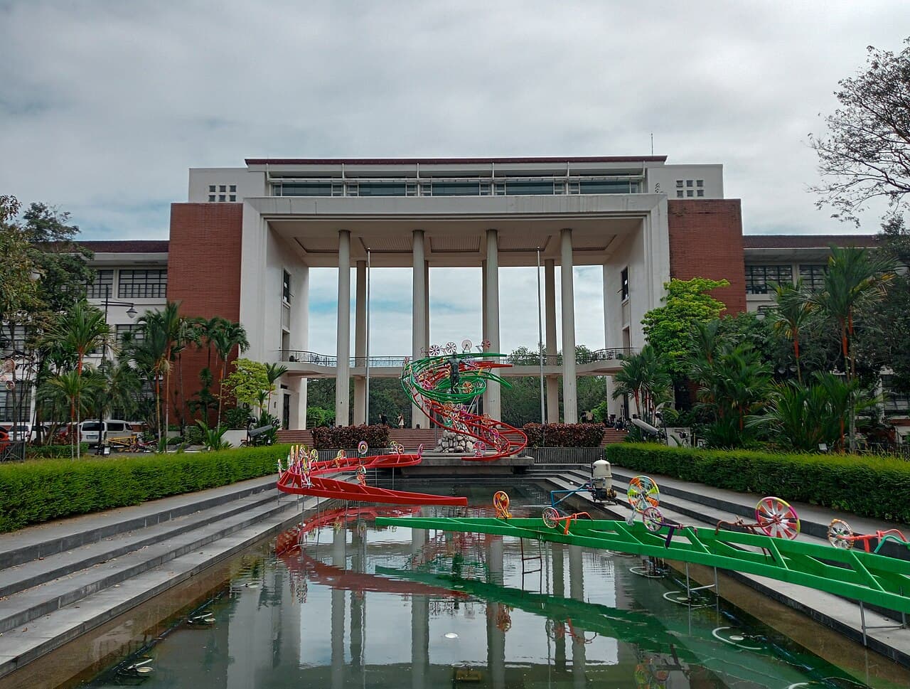 Quezon Hall, the main administration building of the University of the Philippines Diliman, seen across the reflecting pool